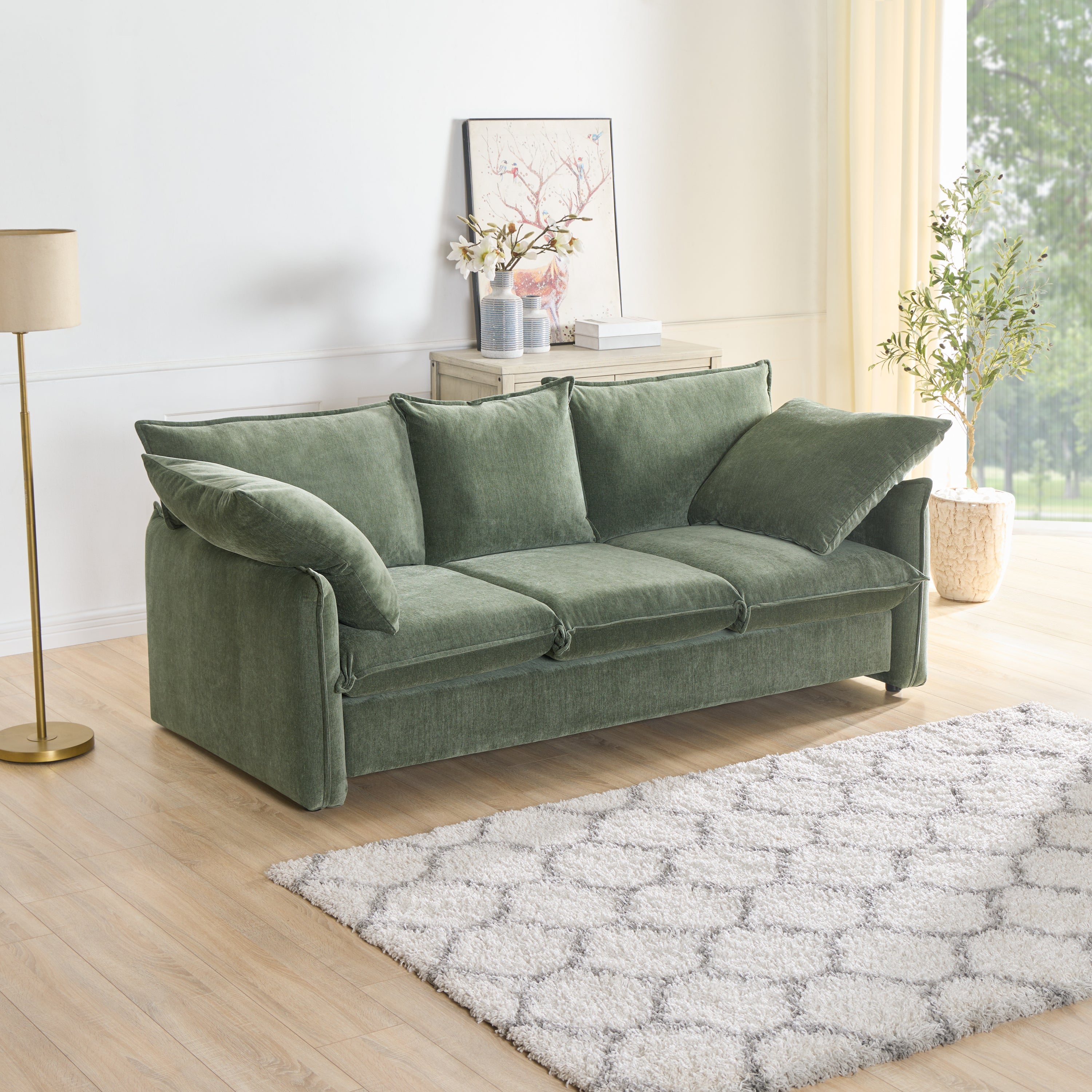 Mid-century 3-seater sofa in green upholstery with stylish stitching, perfect for living rooms and lounges.