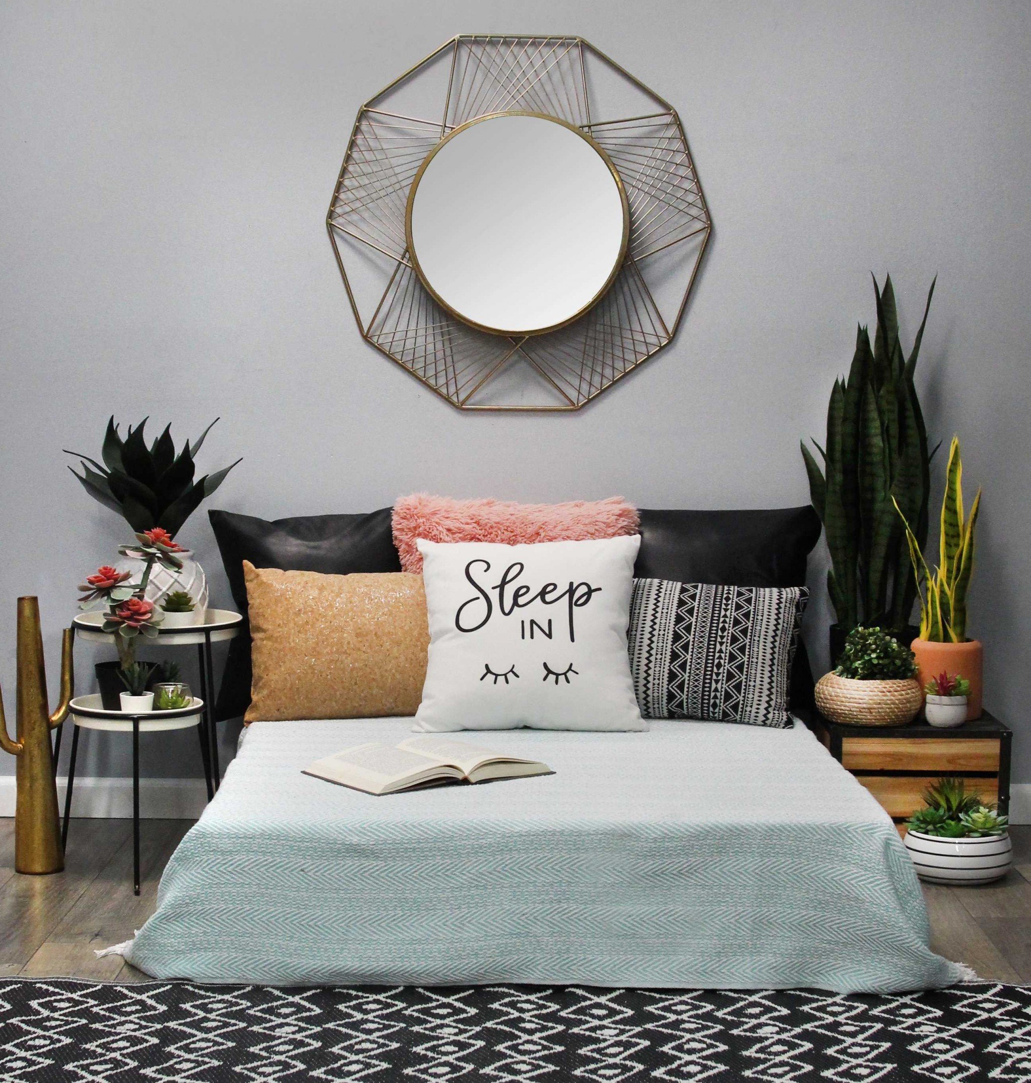 Modern Boho Black And White Stripe Lumbar Accent Pillow on a stylish sofa, showcasing its tribal stripe design and hidden zipper.