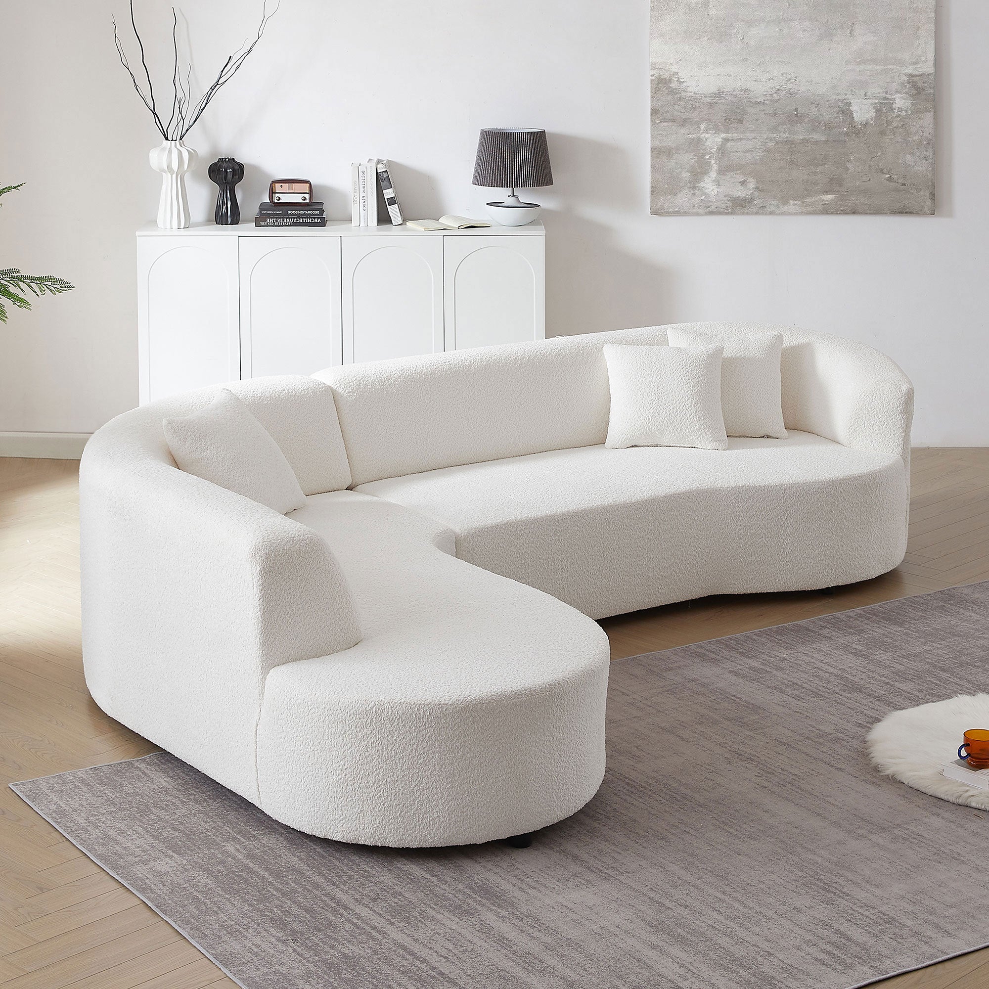 Modular Sectional Sofa with Left Chaises in white boucle fabric, featuring a modern design and plush throw pillows.