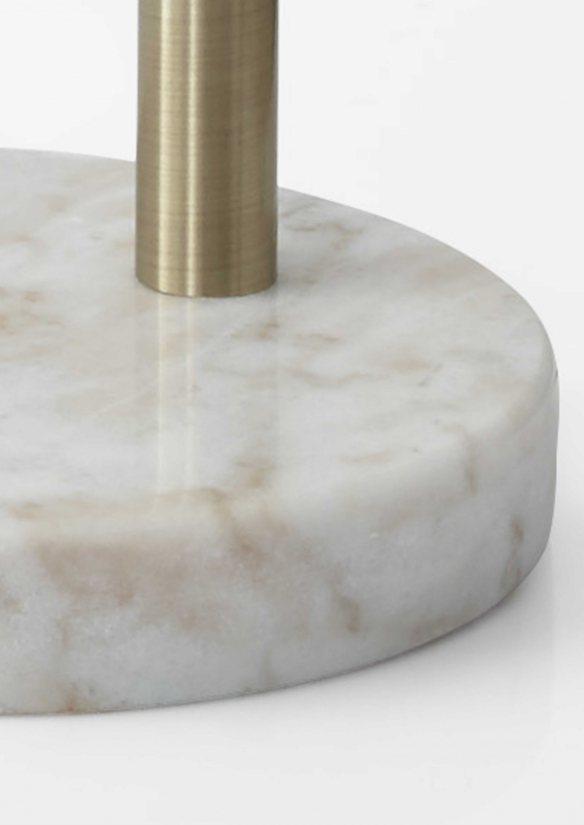 Antique brass arc arm floor lamp with adjustable off-white shade and white marble base, perfect for reading nooks.