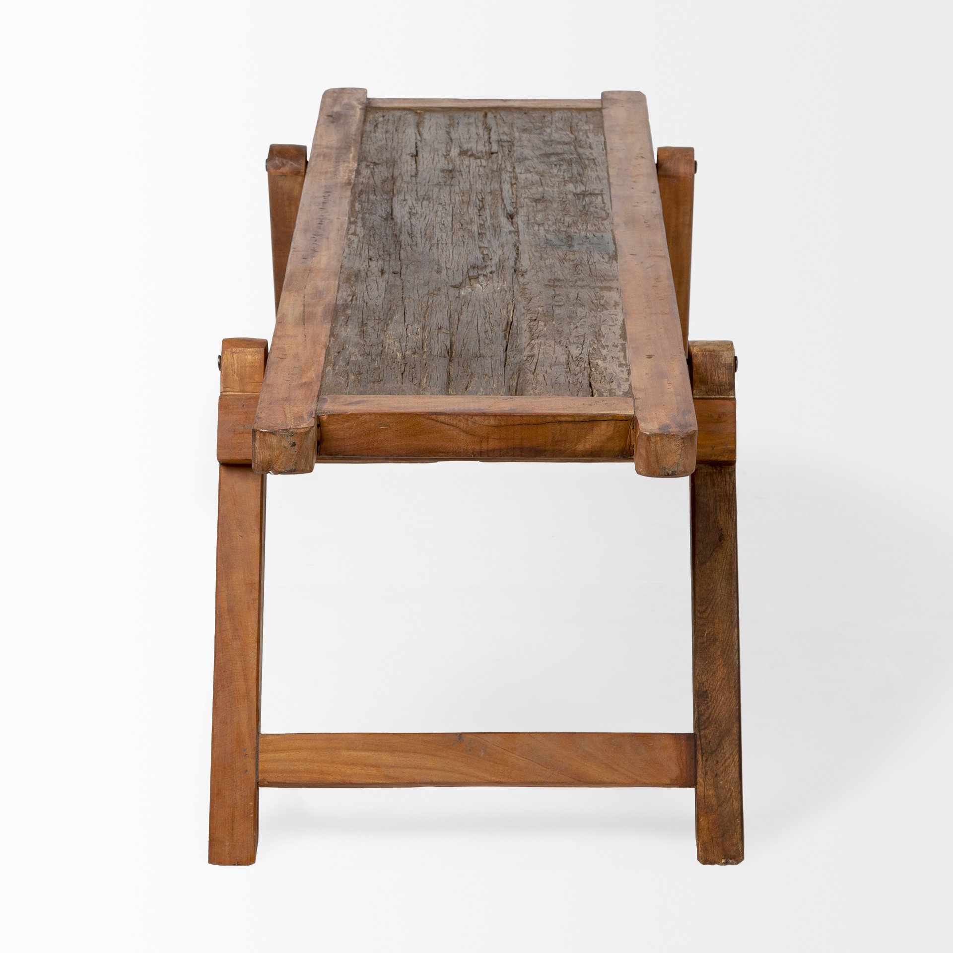 Rectangular mango wood rustic cot style dining bench with angular wide legs, showcasing natural wood grain and rustic finish.