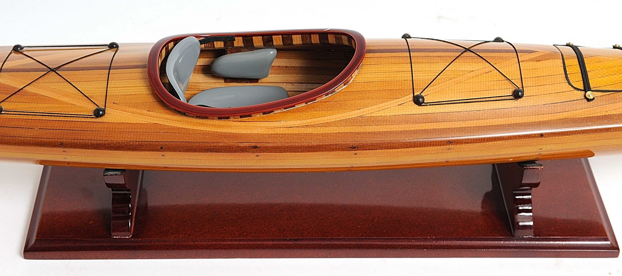 Rich Cedar Kayak Model Sculpture showcasing intricate details and craftsmanship, perfect for display.