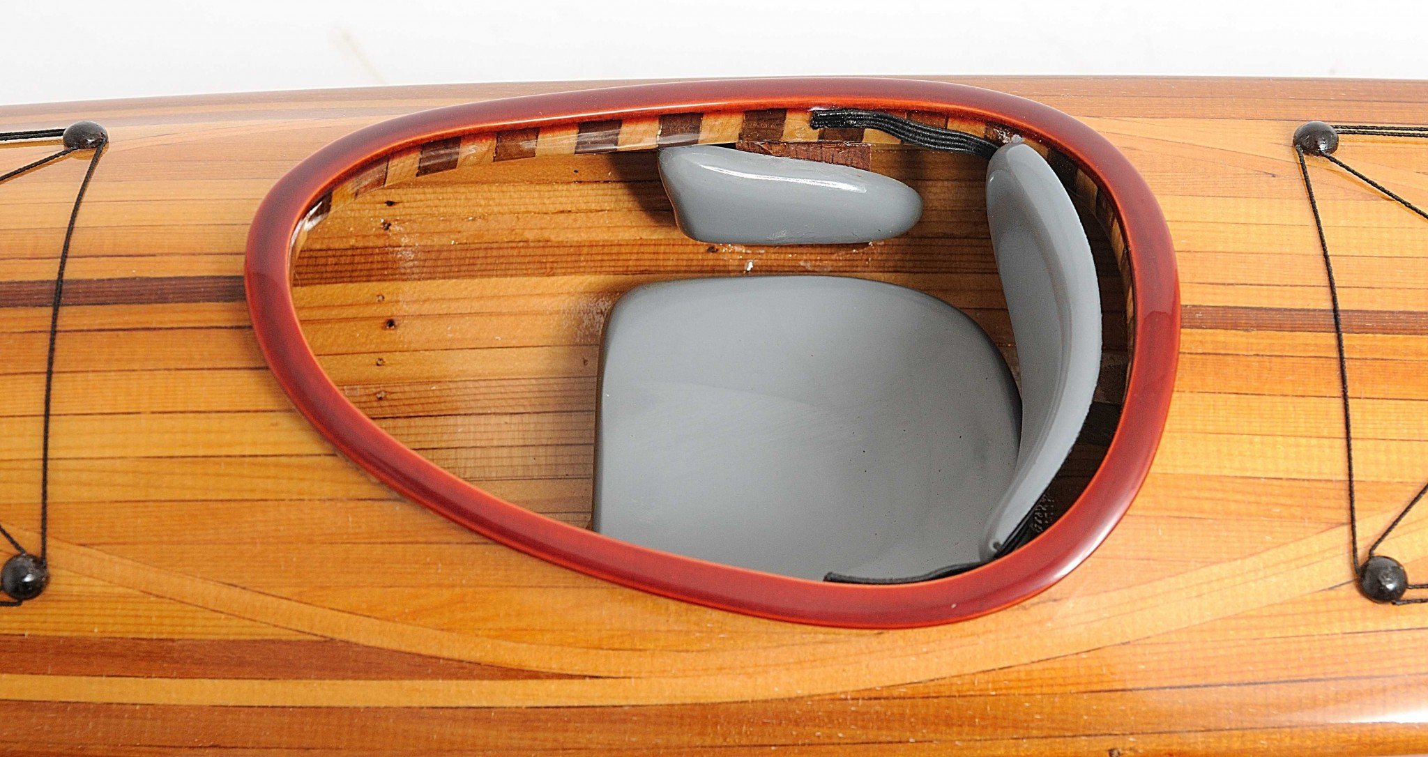 Rich Cedar Kayak Model Sculpture showcasing intricate details and craftsmanship, perfect for display.
