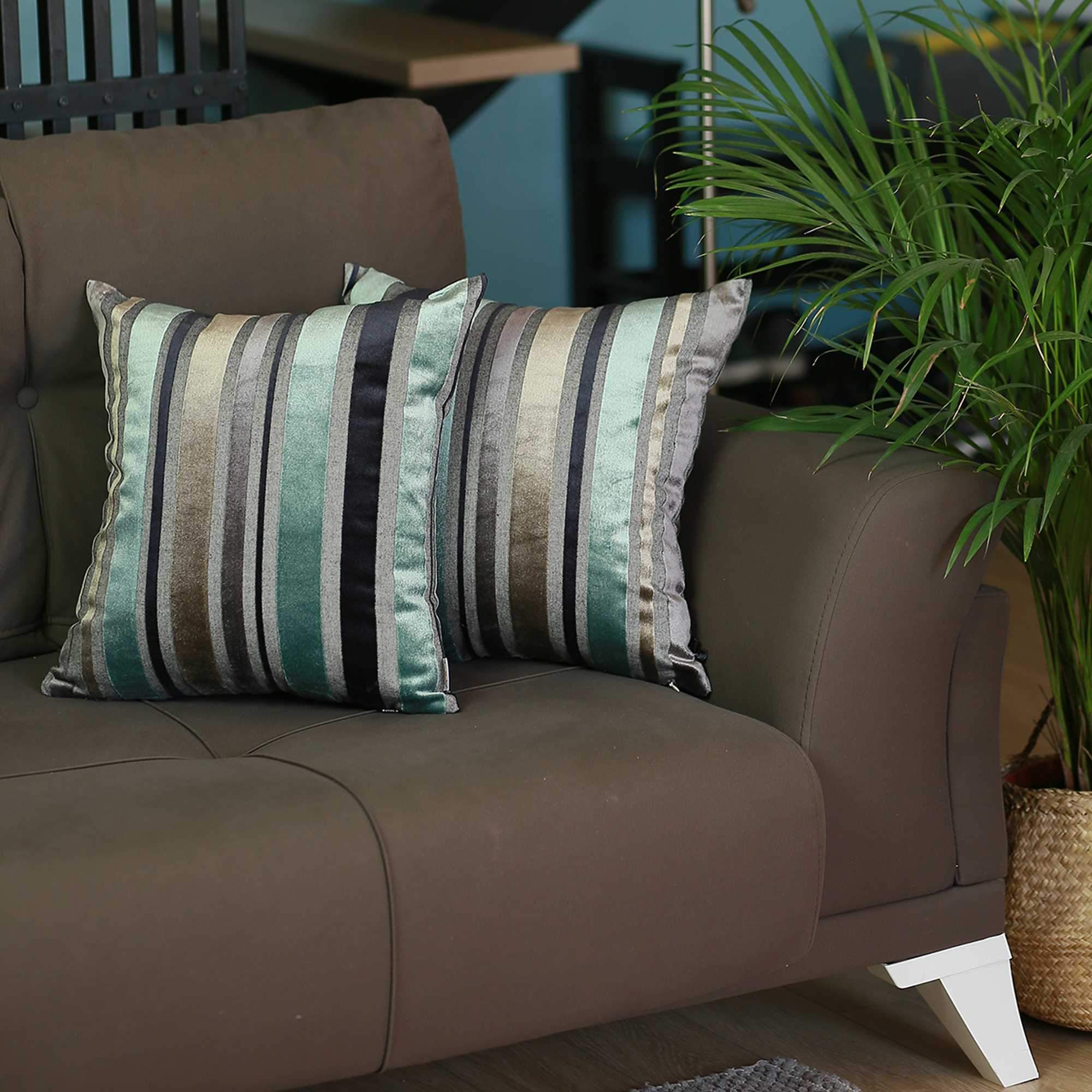 Set of 2 blue variegated stripe decorative pillow covers made from soft velvet fabric, featuring hidden zipper closure and elegant binding edges.