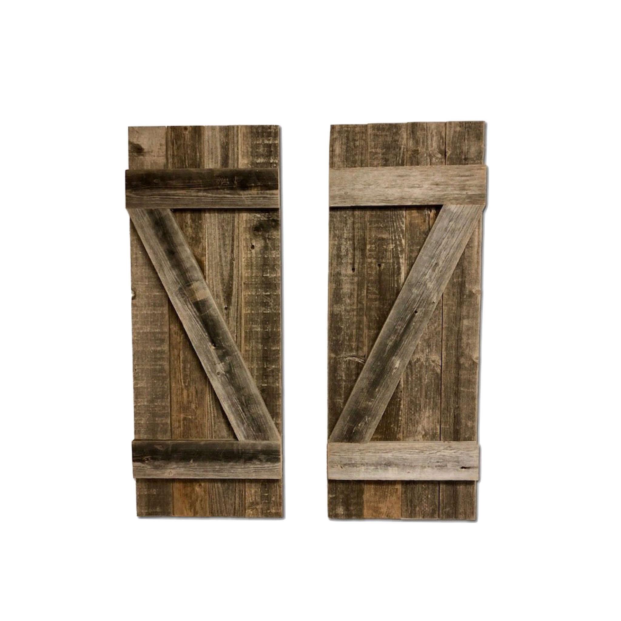 Set of 2 rustic natural weathered grey wood window shutters, showcasing their unique texture and eco-friendly design.
