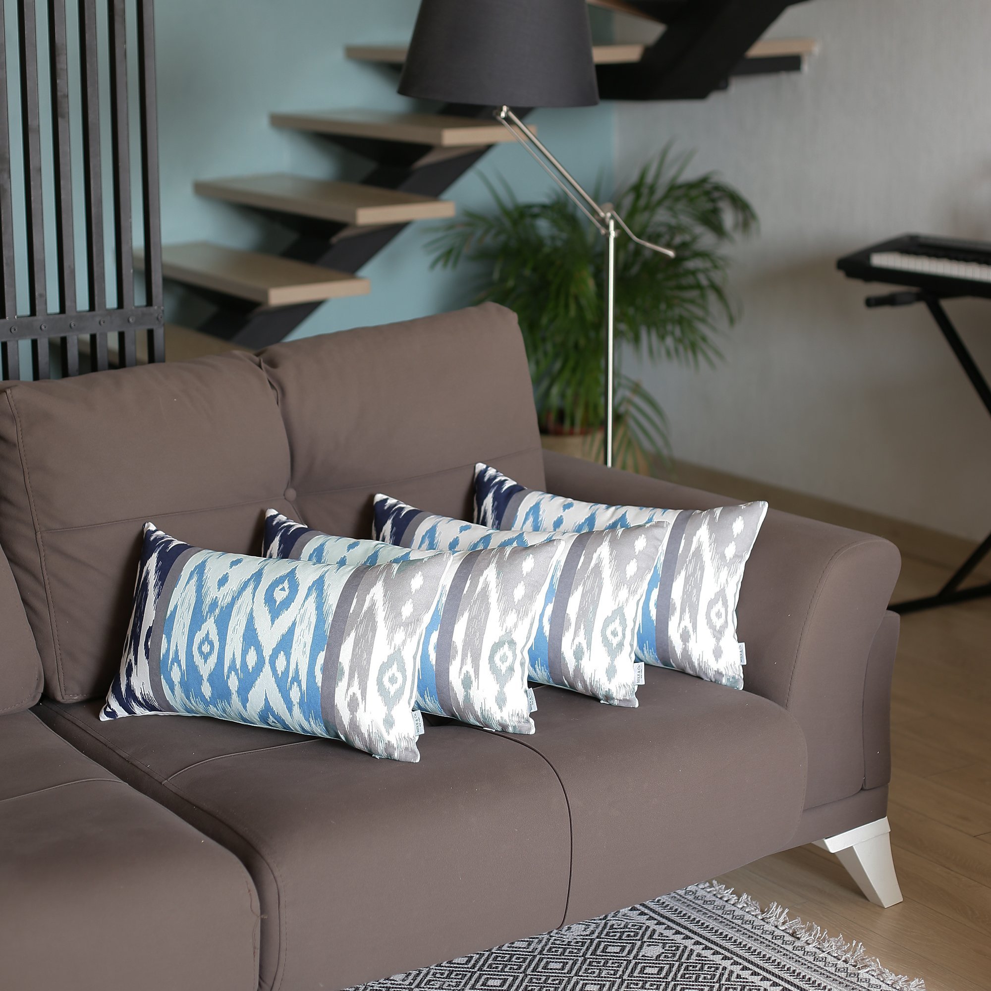 Set of 4 Gray and Yellow Ikat Lumbar Pillow Covers featuring vibrant ikat patterns in teal, navy blue, gray, and white.