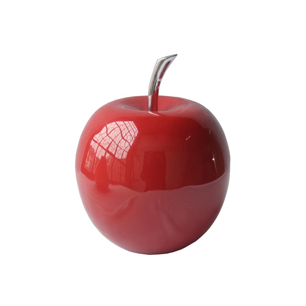 A shiny, polished red apple sculpture with a modern design, showcasing its elegant curves and vibrant color, perfect for home decor.