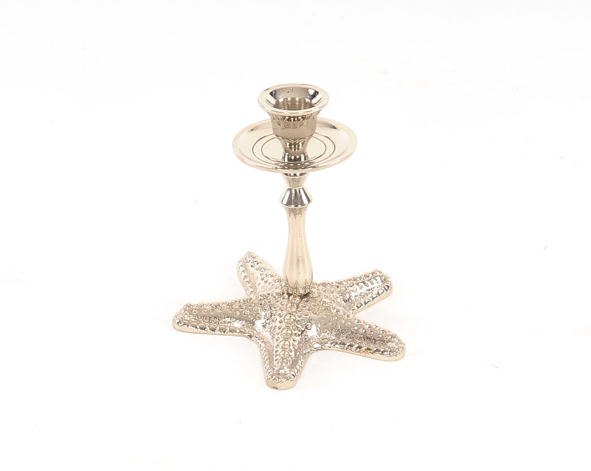 A beautiful silver finish starfish taper candle holder made of solid brass, showcasing a unique starfish design.