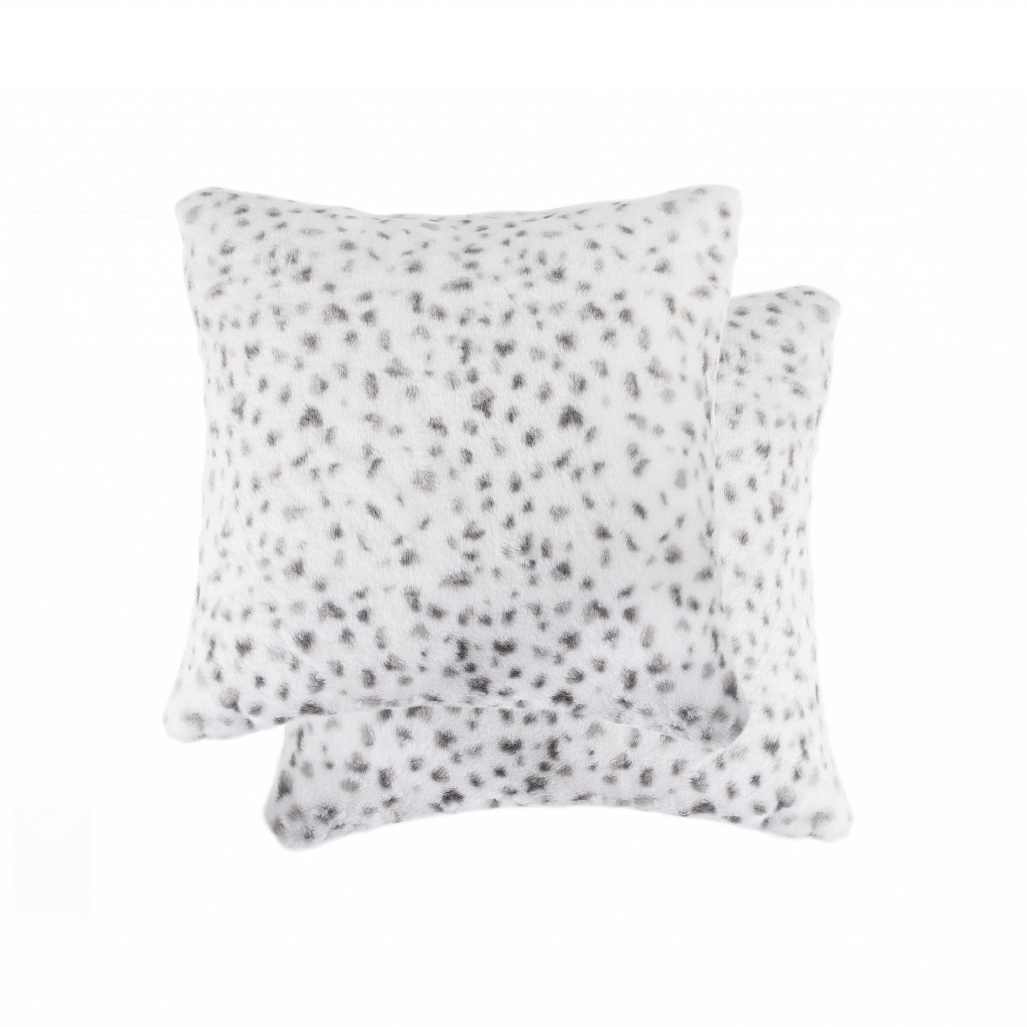 Two luxurious Snow Leopard Faux Fur Pillows with a soft, plush texture, showcasing a stylish and elegant design perfect for home decor.