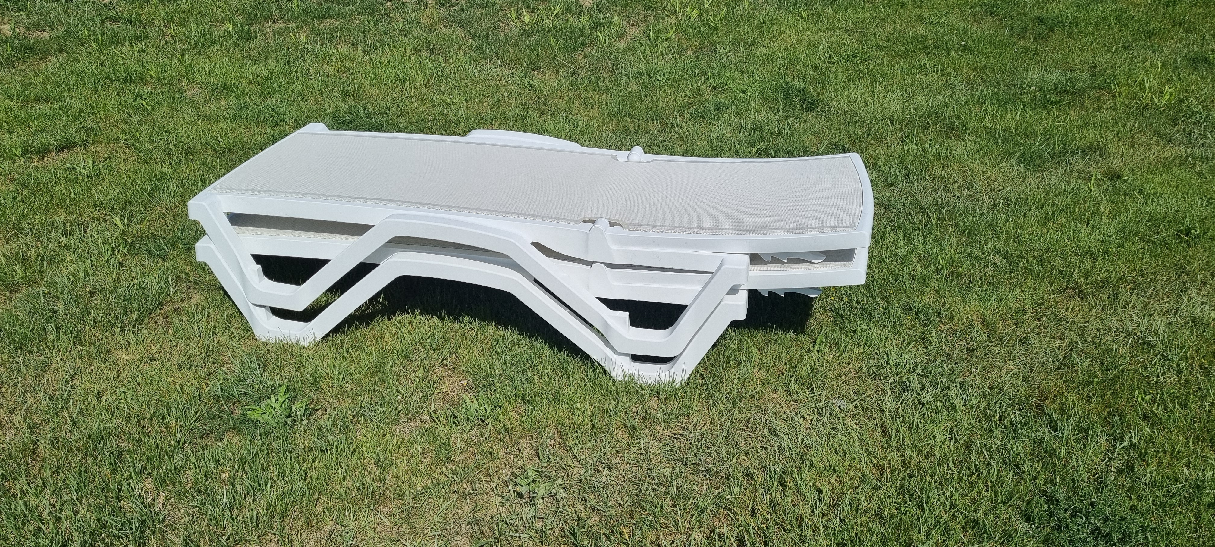 Set of 2 Pacific Sunloungers featuring durable polypropylene and breathable PVC-Coated Polyester seating, perfect for outdoor relaxation.