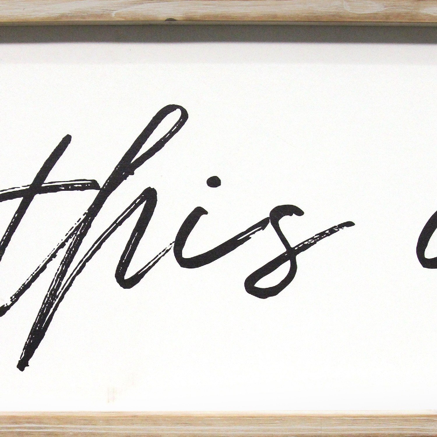 Handcrafted 'This Is Us' wood framed wall art in black script font, showcasing family pride with a natural wood frame.