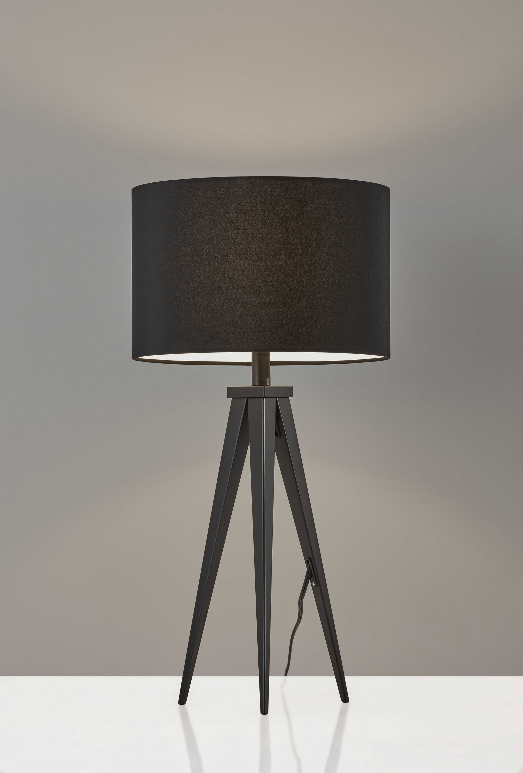 Treble Black Metal Table Lamp featuring tripod legs and black drum shade, ideal for modern decor.