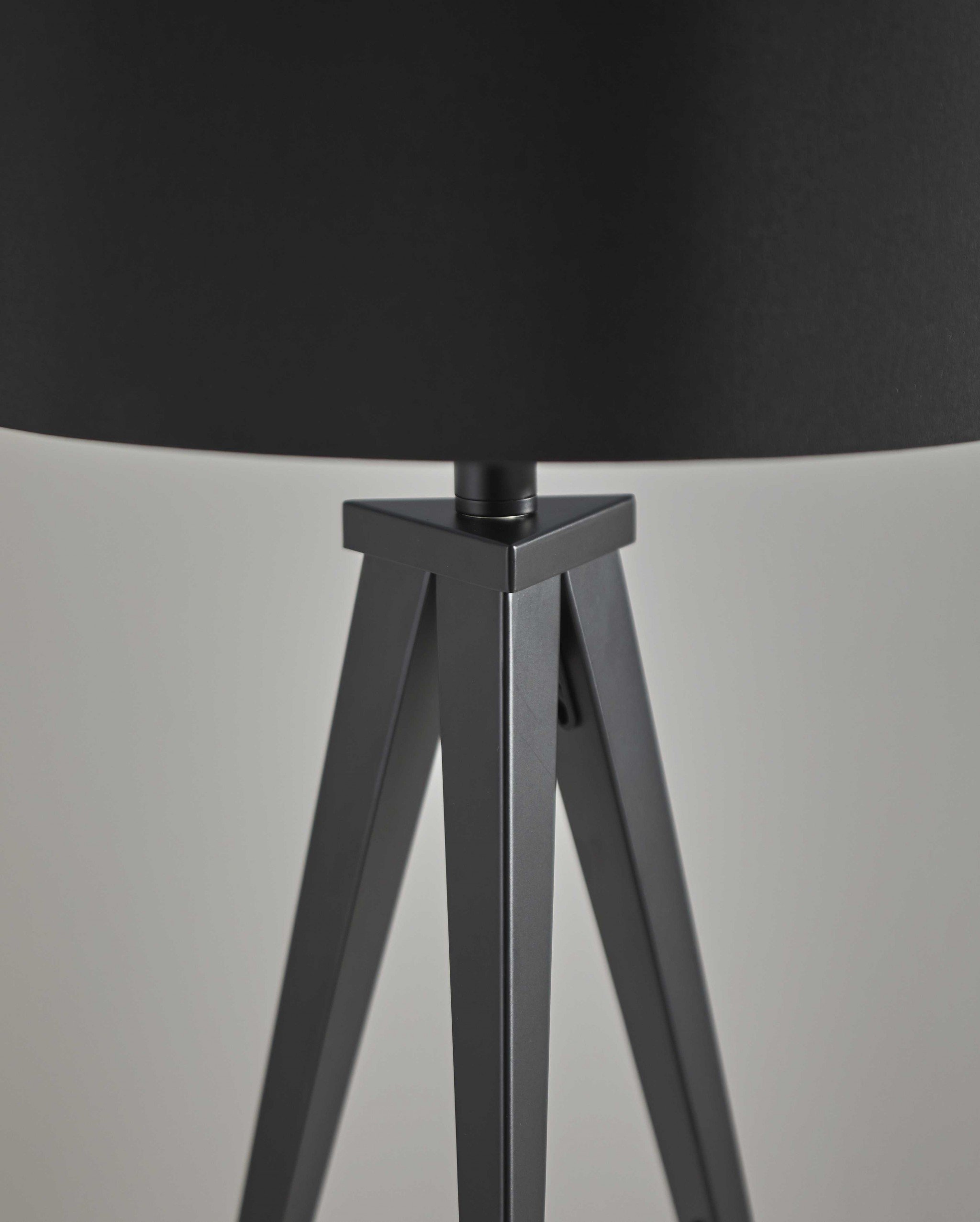 Treble Black Metal Table Lamp featuring tripod legs and black drum shade, ideal for modern decor.