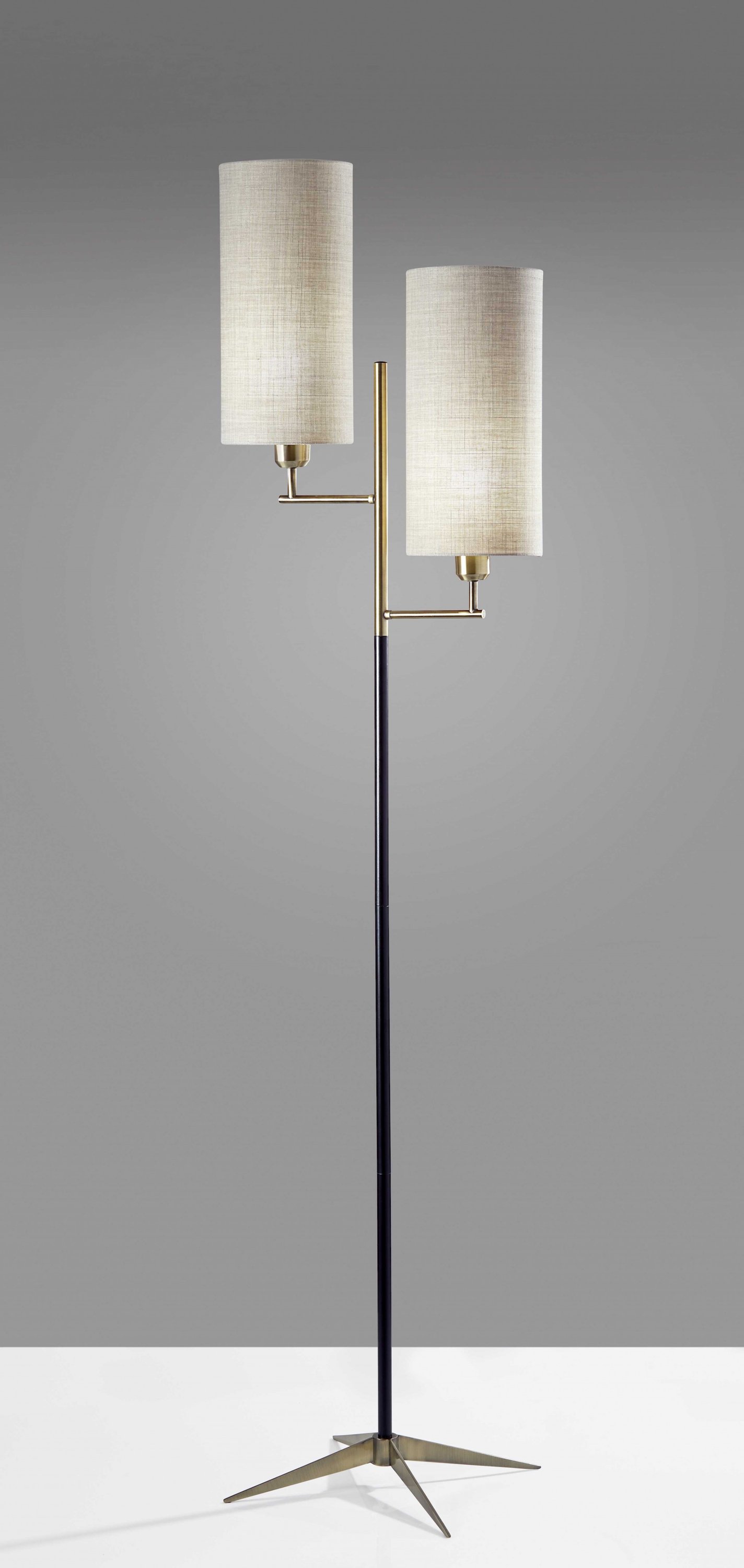 Two Light Floor Lamp with antique brass tripod base and matte black accents, featuring a tall fabric shade.