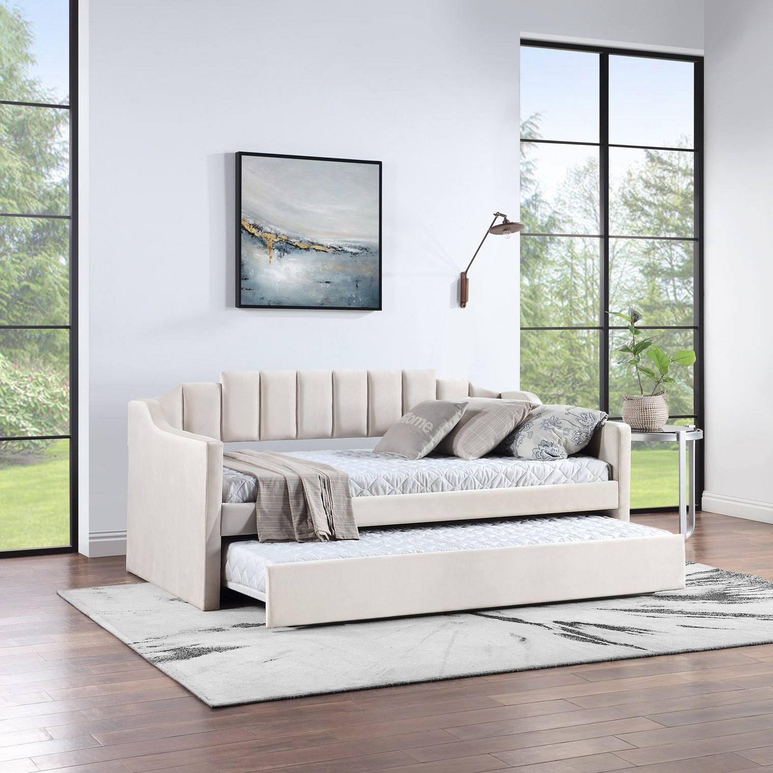 Velvet daybed with trundle in beige upholstery, featuring tufted design and solid wood frame, perfect for small spaces.
