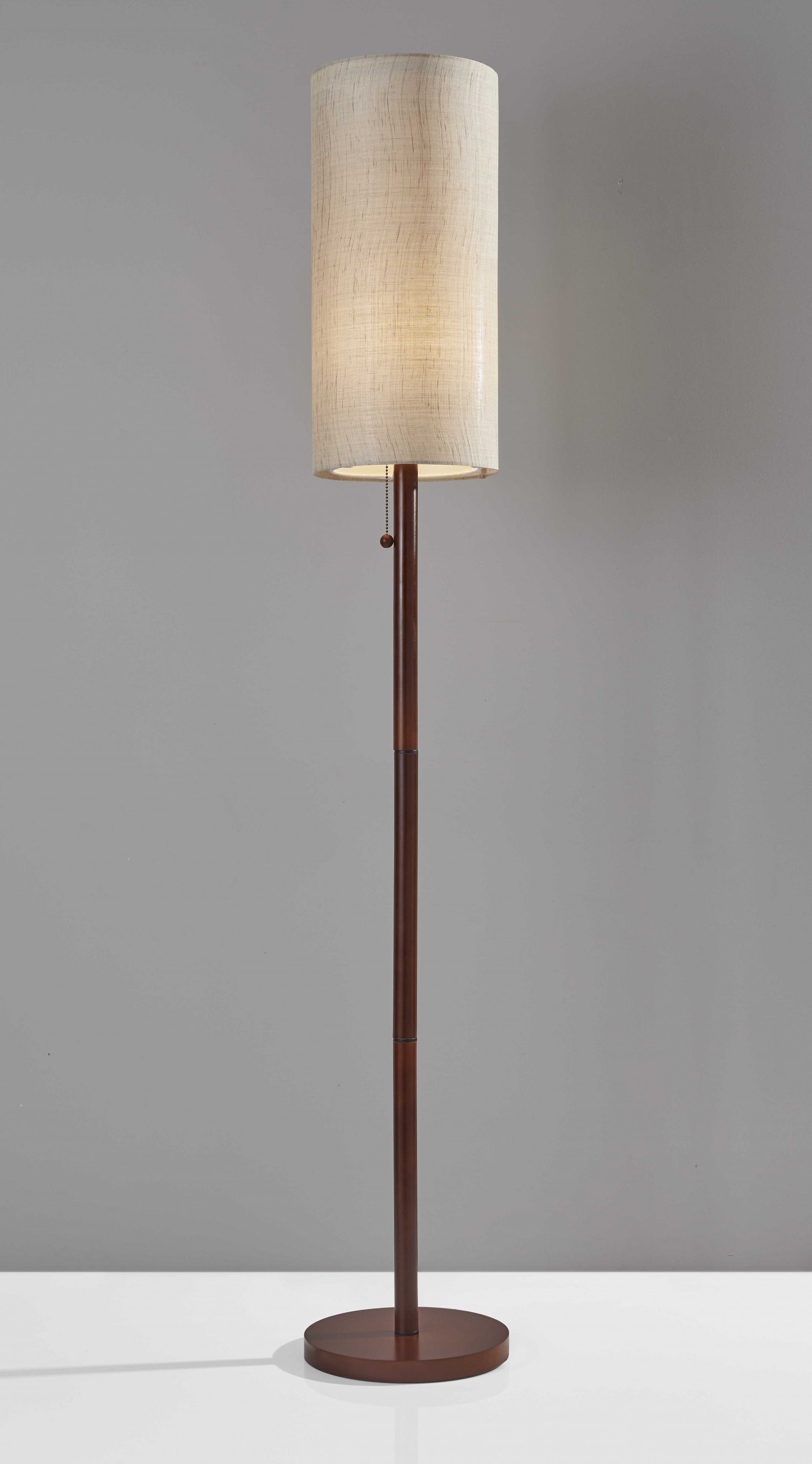 Walnut wood finish floor lamp with a slim cylindrical shade, featuring a wooden pole and a decorative wood ball pull-chain.