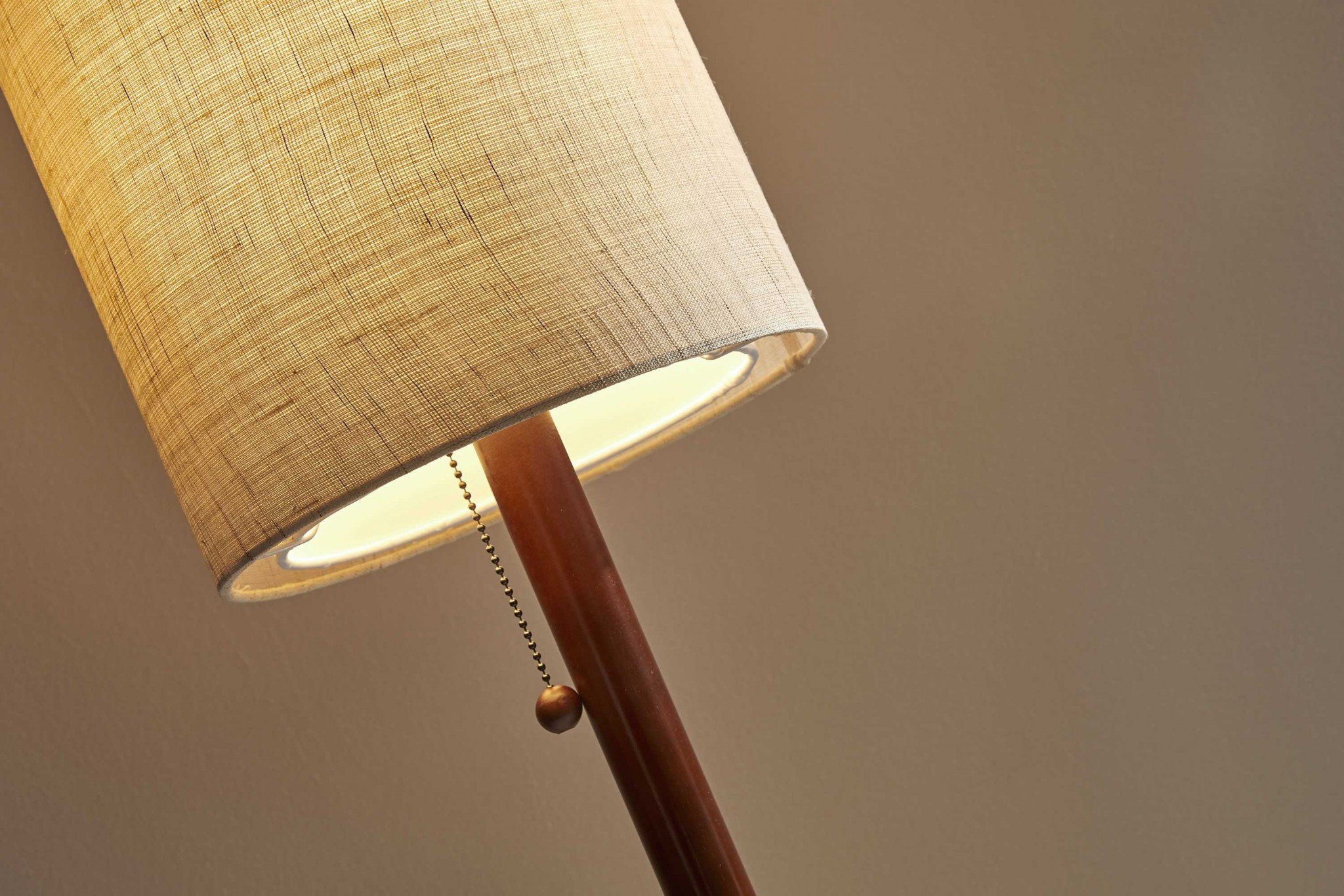 Walnut wood finish floor lamp with a slim cylindrical shade, featuring a wooden pole and a decorative wood ball pull-chain.