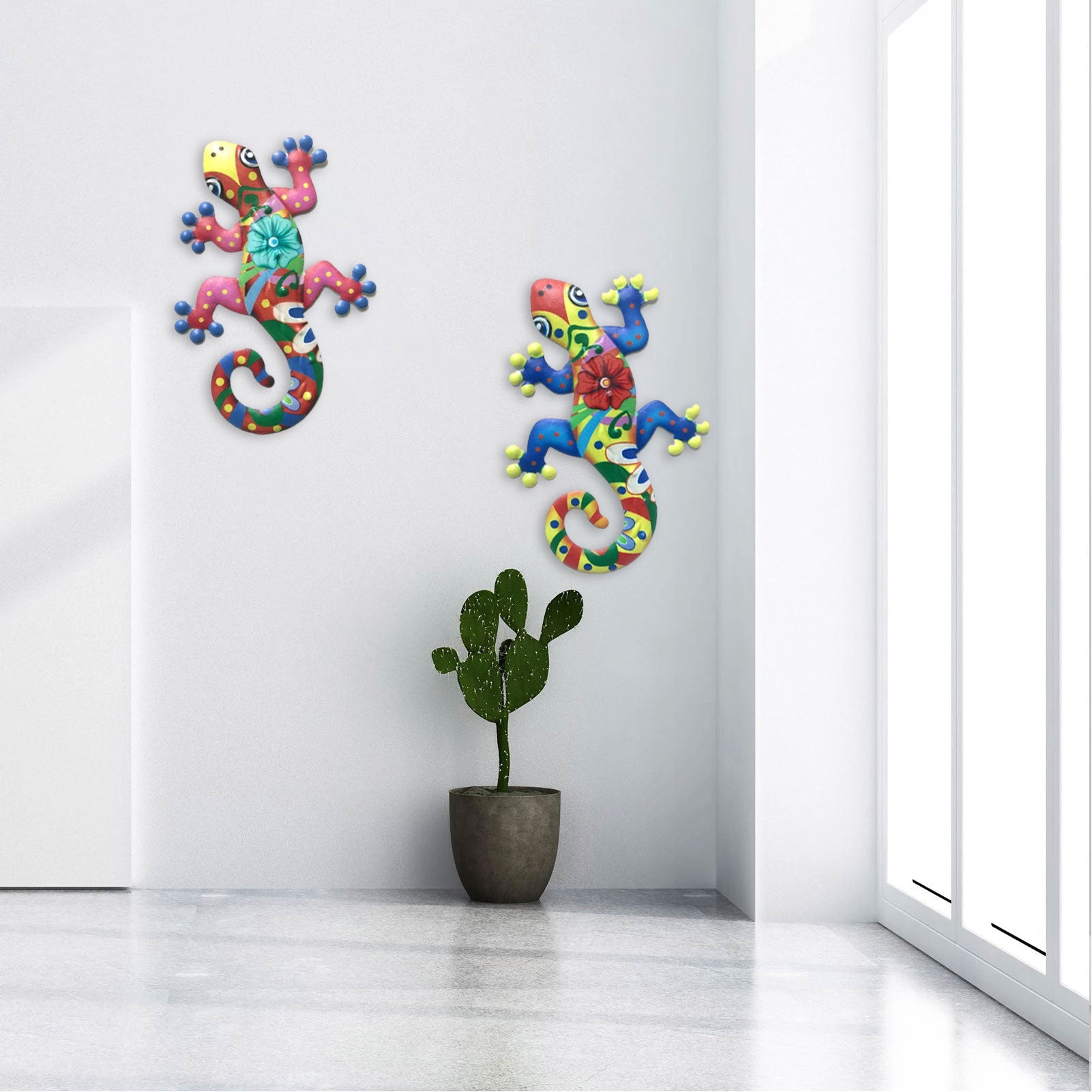 Two colorful metal gecko wall decor sculptures with intricate designs, perfect for indoor and outdoor decoration.