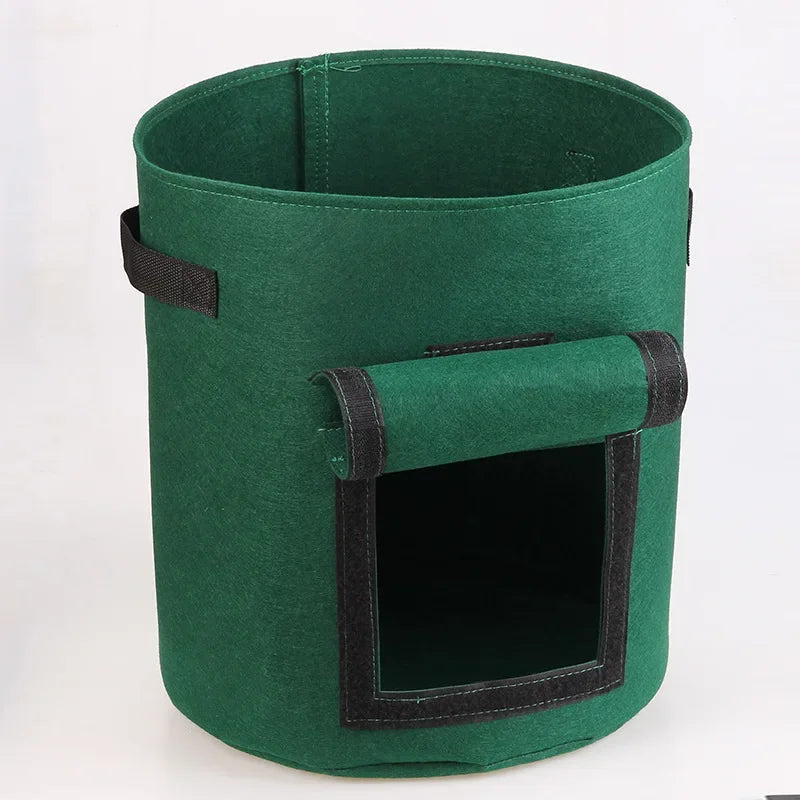 Three green felt plant grow bags made of nonwoven fabric, designed for growing potatoes and vegetables in a garden or greenhouse setting.