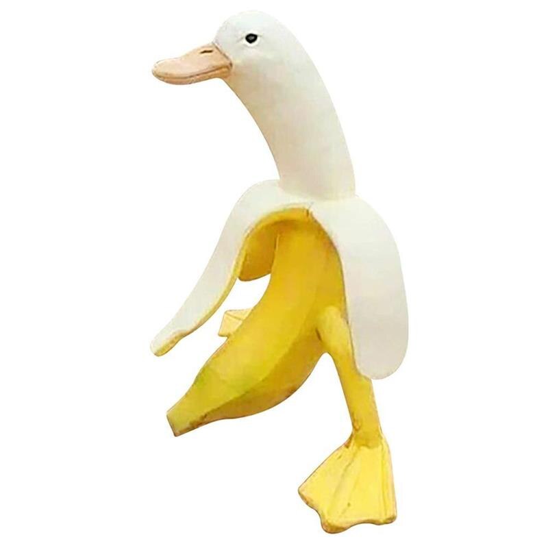 A whimsical Art Banana Duck Statue featuring a banana peel design with a duck head and feet, perfect for garden and desktop decor.