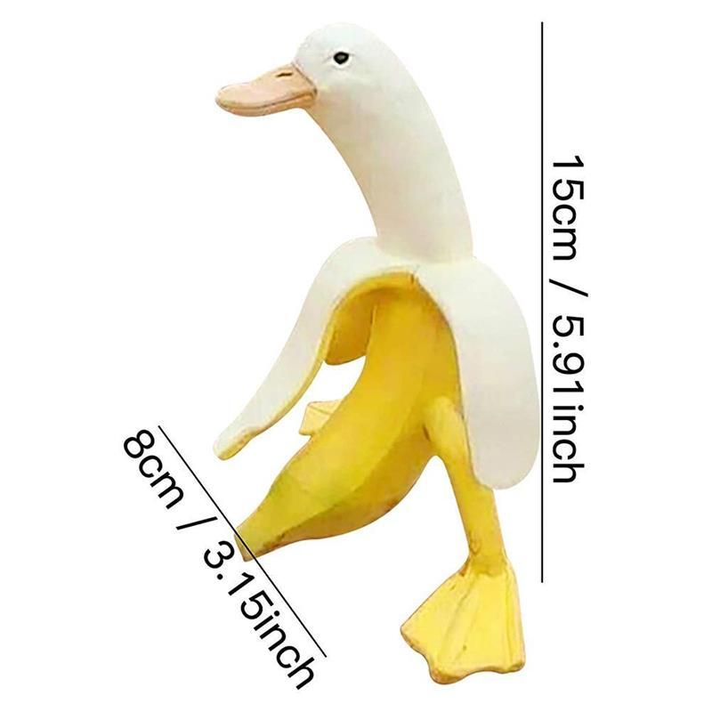 A whimsical Art Banana Duck Statue featuring a banana peel design with a duck head and feet, perfect for garden and desktop decor.