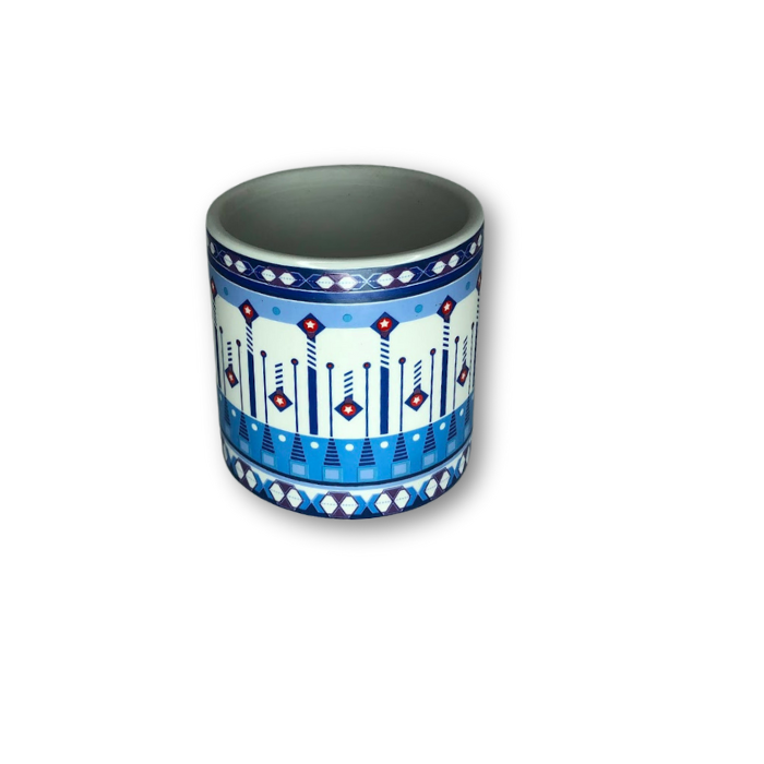 A blue ceramic cup pot featuring an intricate Aztec pattern, perfect for small plants.