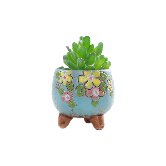Blue oval shaped ceramic succulent pot with floral design and three legs, perfect for indoor plants.