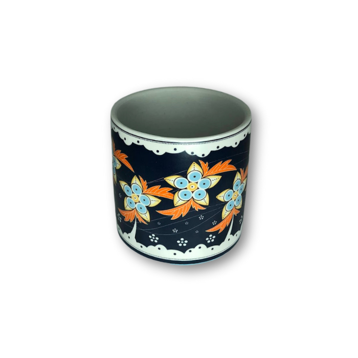 A dark blue flower pot featuring an intricate floral pattern, perfect for small plants.