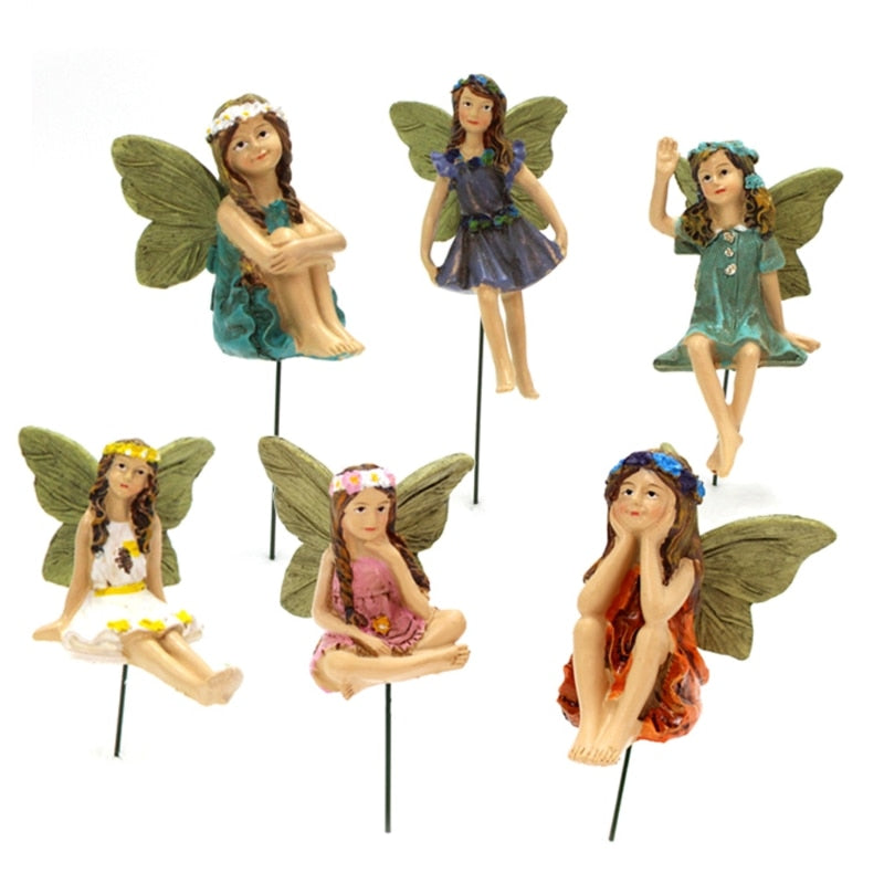 A colorful set of 6 miniature fairy figurines, made of resin, designed for fairy gardens, showcasing vibrant colors and intricate details.