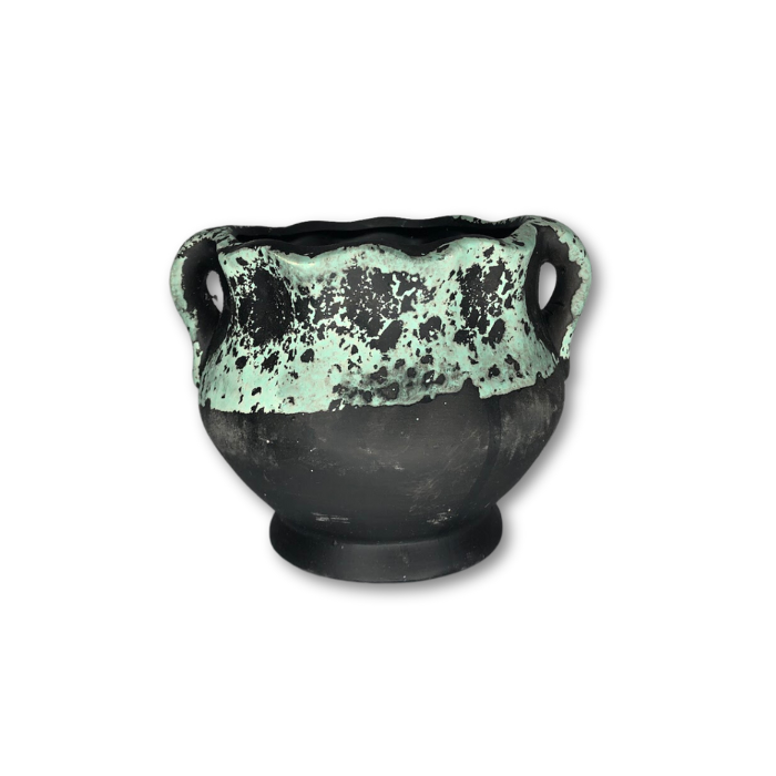 A stylish black pot featuring a unique green sponge pattern, perfect for indoor and outdoor plants.