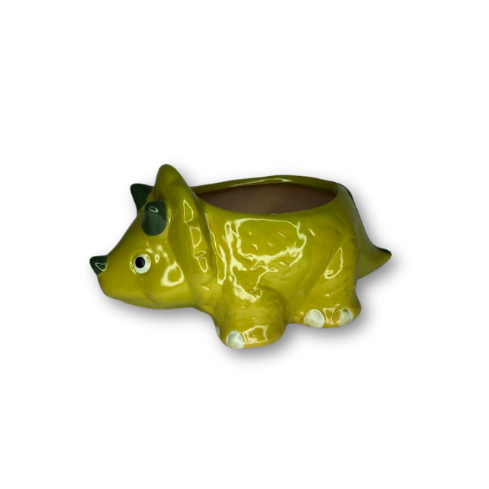 A vibrant green ceramic flower pot shaped like a triceratops, featuring a drainage hole at the bottom.