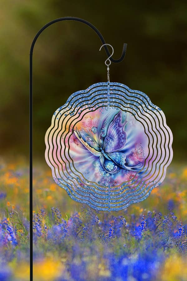 A vibrant purple and pink butterfly wind spinner, 10 inches in diameter, hanging in a garden setting, showcasing its double-sided design.