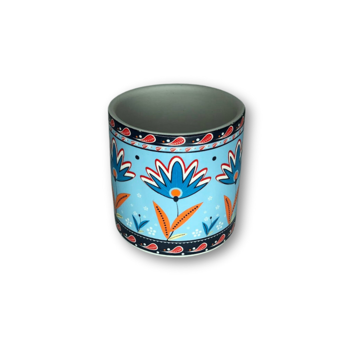 Light blue ceramic cup pot with floral pattern, perfect for small plants.