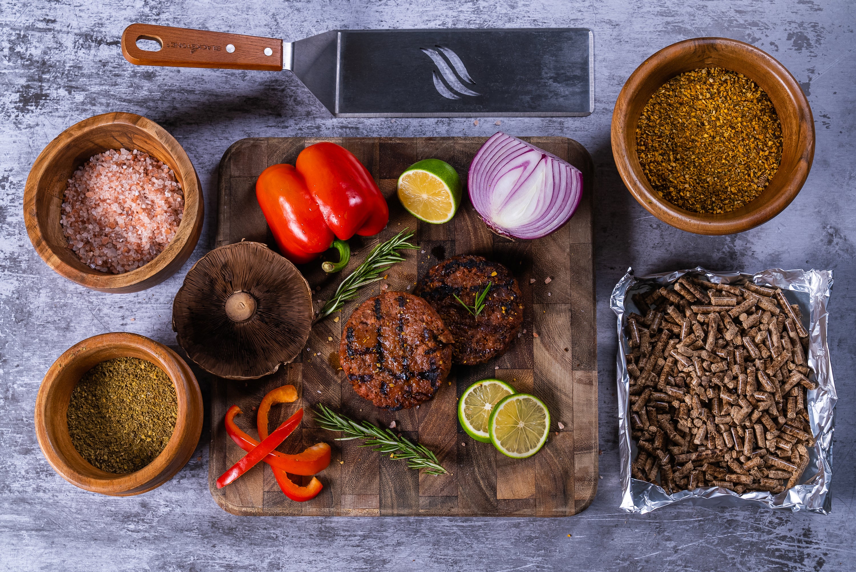 A 20lb bag of Manchester Barbecue Pellets featuring a blend of Hickory, Oak, Maple, and Cherry wood, ideal for grilling and smoking.