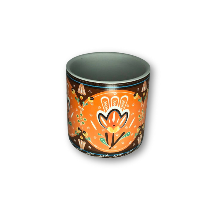 A vibrant orange cup pot featuring a beautiful floral pattern, perfect for small plants and home decor.