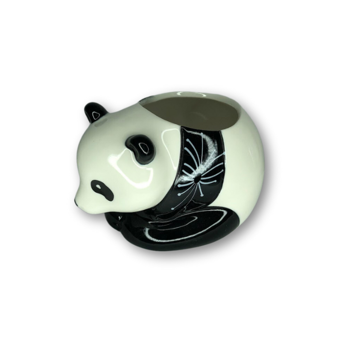 A charming panda planter with a flare pattern, perfect for small plants, featuring a drain hole at the bottom.