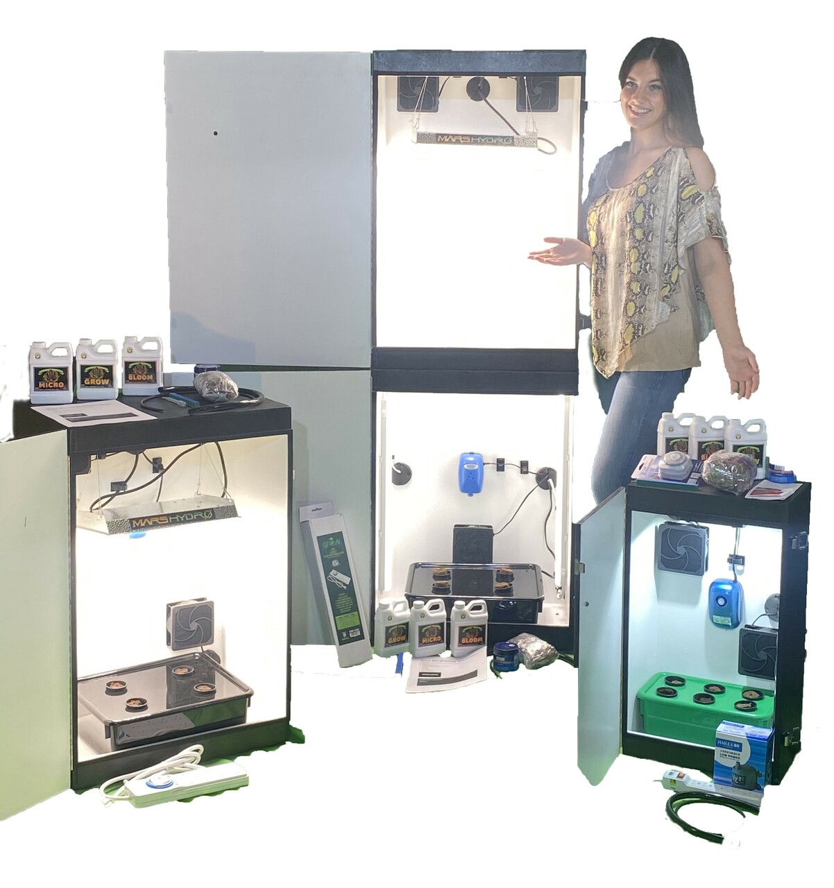 Person demonstrating indoor hydroponic equipment.