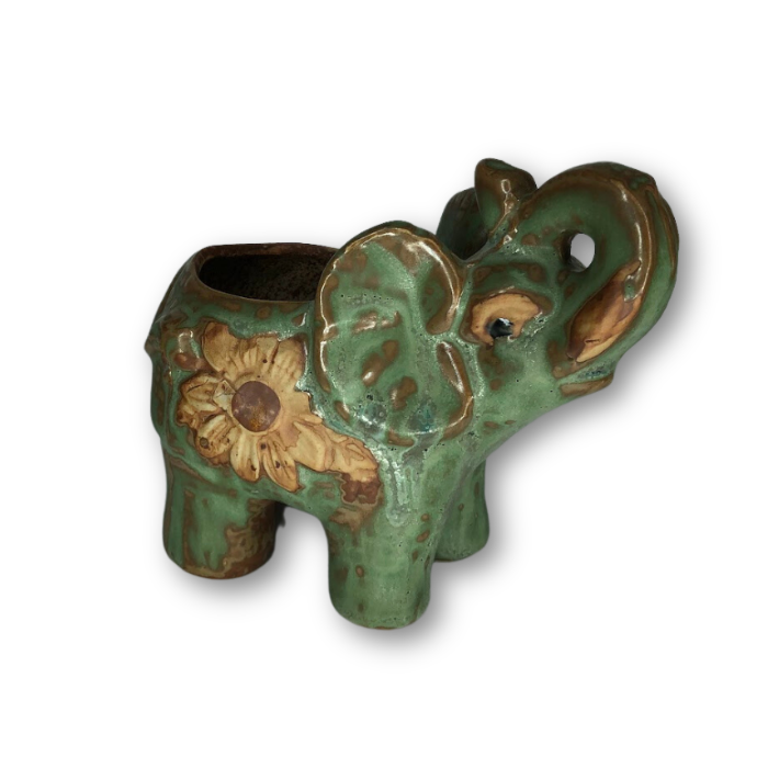 Rustic antique green elephant-shaped flower pot with a flower design, featuring a drainage hole at the bottom.