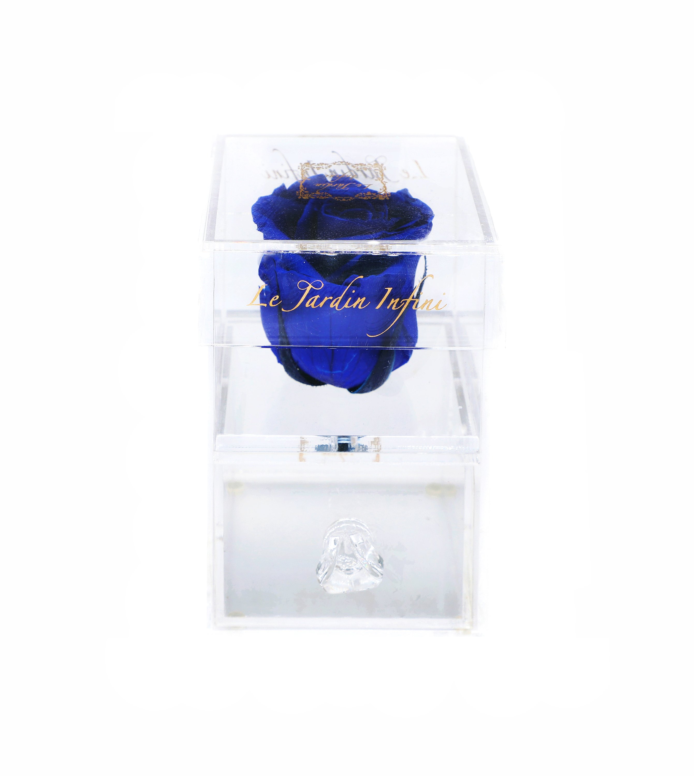 A single vibrant purple preserved rose displayed in a sleek acrylic box with a drawer, showcasing its beauty and elegance.