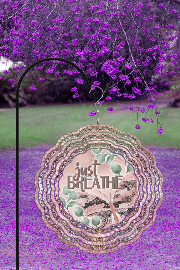 A vibrant 10-inch aluminum wind spinner featuring a calming 'Just Breathe' design, perfect for spring home decor.