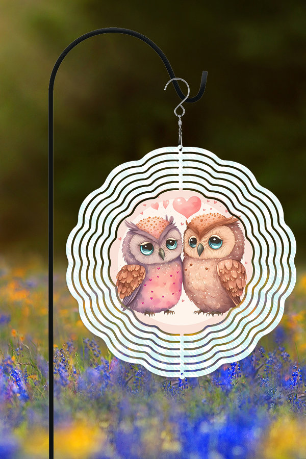 A colorful 10-inch double-sided wind spinner featuring whimsical owls and hearts, designed for Valentine's Day garden decor.