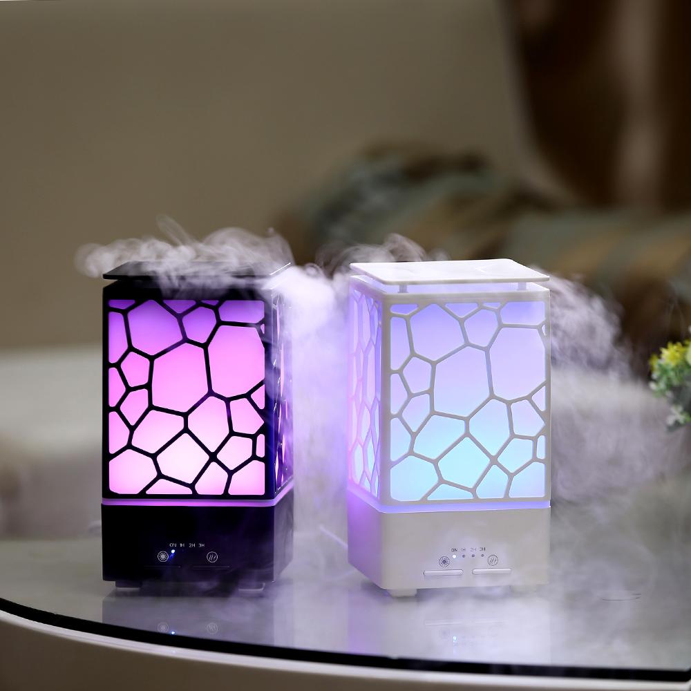 A stylish 2 in 1 Essential Oil Diffuser and Ultrasonic Humidifier with 7 color options, emitting a soothing mist.