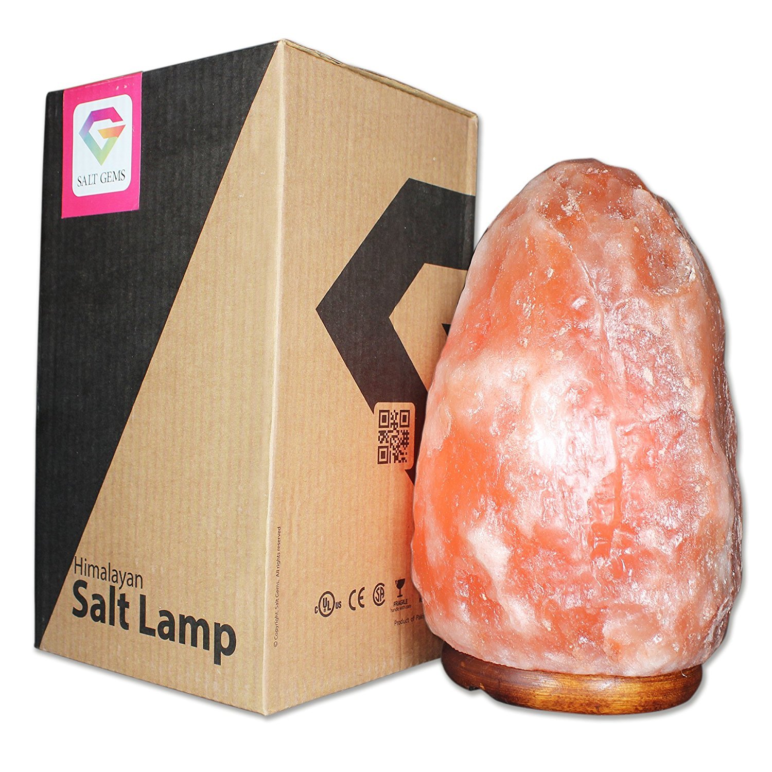 Two hand-carved Natural Himalayan Salt Lamps on a wooden base, showcasing unique shapes and warm amber glow.