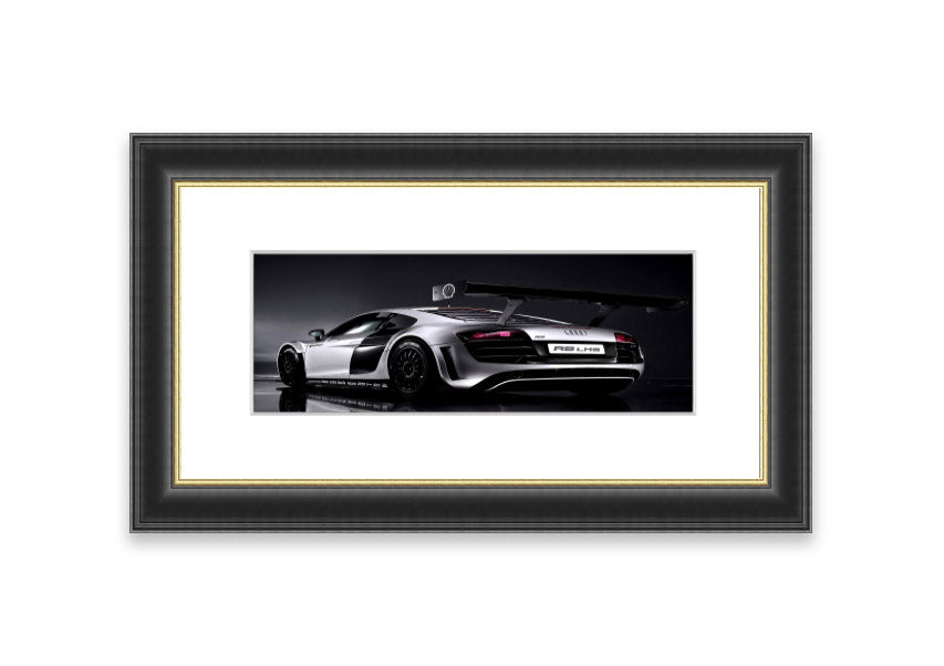 Framed print of the 2010 Audi R8 Lms, showcasing its sleek design and vibrant colors, ready to hang.