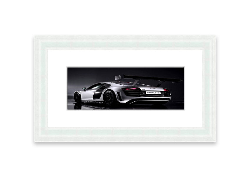 Framed print of the 2010 Audi R8 Lms, showcasing its sleek design and vibrant colors, ready to hang.