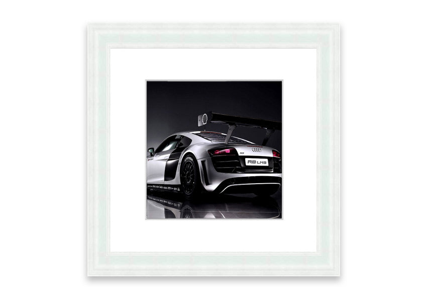 Framed print of the 2010 Audi R8 Lms, showcasing its sleek design and vibrant colors, ready to hang.