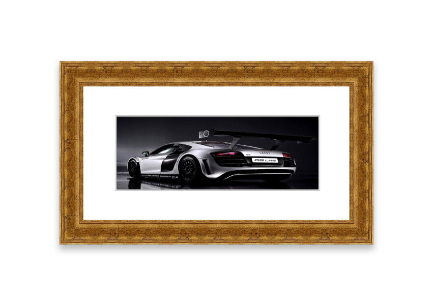 Framed print of the 2010 Audi R8 Lms, showcasing its sleek design and vibrant colors, ready to hang.