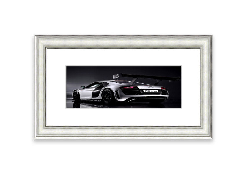 Framed print of the 2010 Audi R8 Lms, showcasing its sleek design and vibrant colors, ready to hang.