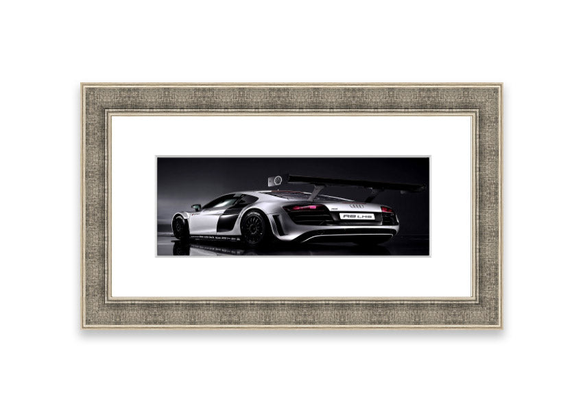 Framed print of the 2010 Audi R8 Lms, showcasing its sleek design and vibrant colors, ready to hang.