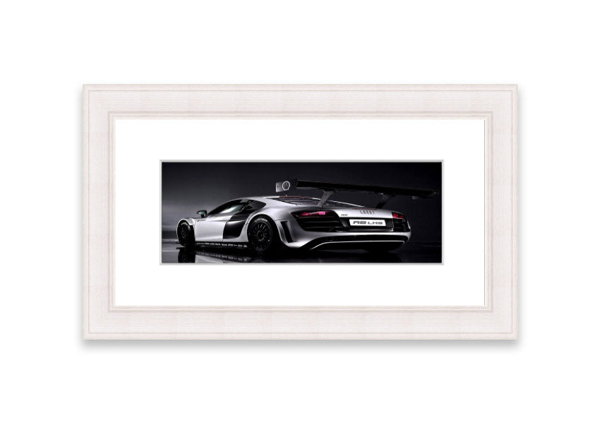Framed print of the 2010 Audi R8 Lms, showcasing its sleek design and vibrant colors, ready to hang.